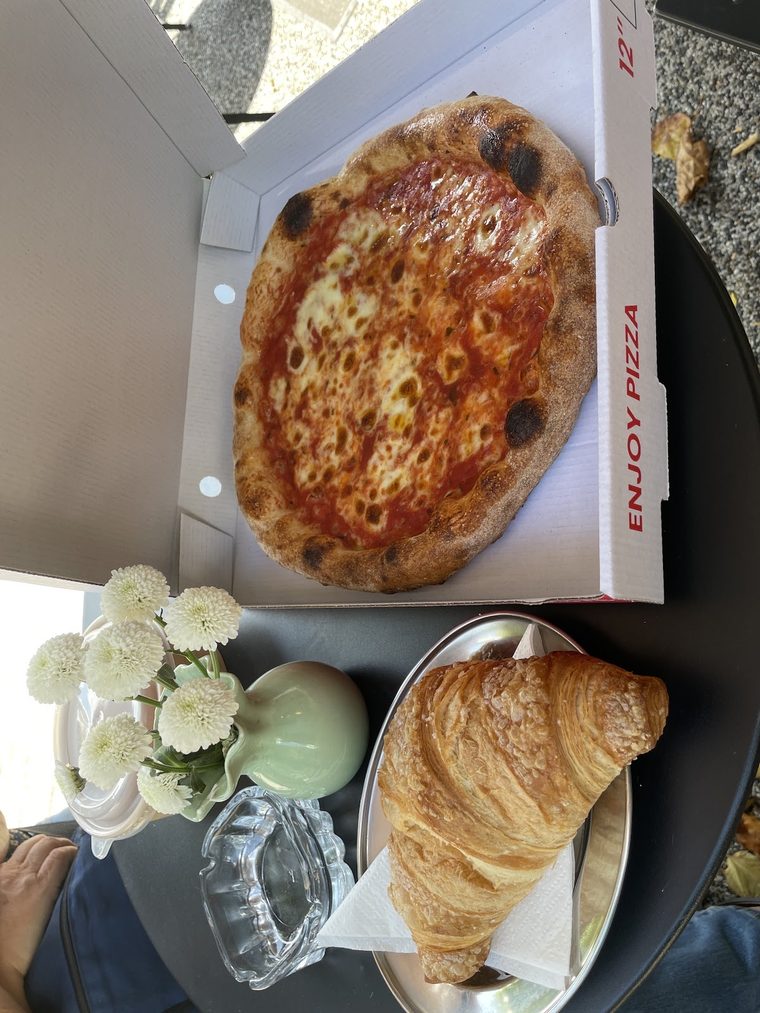 A margherita pizza, cropped tight